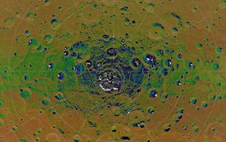 The highest-resolution radar image of Mercury’s south polar region made from the Arecibo Observatory (Harmon et al., Icarus, 211, 37-50, 2011) is shown in white on MESSENGER orbital images colorized by the illumination map. Radar-bright features in the Arecibo image all collocate with areas mapped as in permanent shadow, consistent with the proposal that radar-bright materials contain water ice.