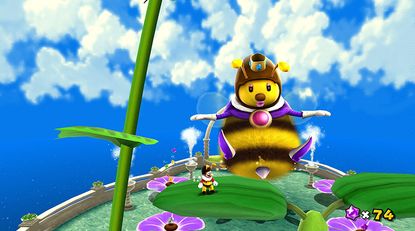 Mario stands next to the queen bee in a bee outfit in the Honeyhive Galaxy in Super Mario Galaxy, from the Nintendo Switch eShop