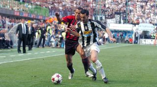 Gianluca Zambrotta of Juventus and Cafu of AC Milan compete for the ball.