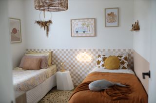 A bedroom with a half wall painted pattern