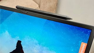 A stylus ontop of the Lenovo ThinkPad X1 Fold Gen 2