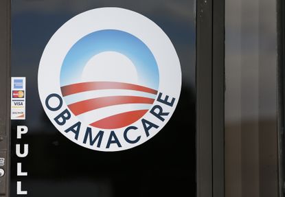 The ObamaCare logo appears on a door in Florida
