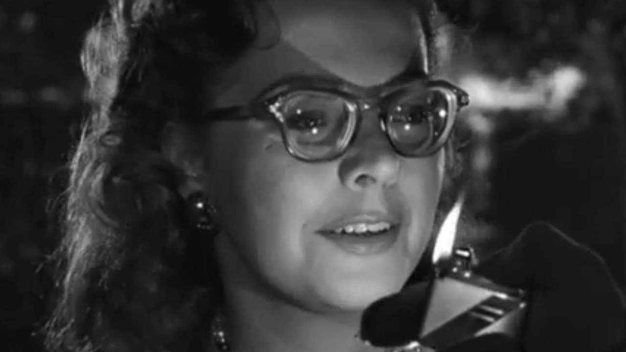 Kasey Rogers accepting a light in Strangers on a Train