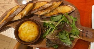 St Marcellin cheese served with bread, salad, mountain honey and truffle oil