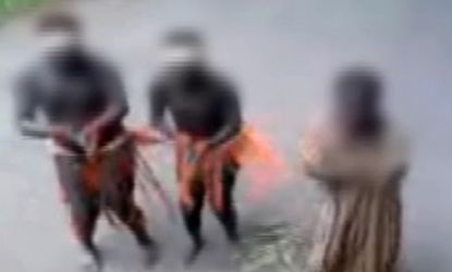 Members of an endangered African tribe living on a reserve in India dance for tourists after being egged on by an apparently bribed policeman leading an illegal safari.