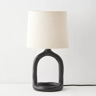 table lamp with a curved, cutout resin base