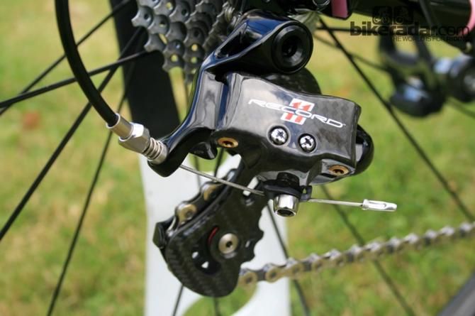 The Campagnolo Record 11 had carbon flourishes in the rear derailleur arm