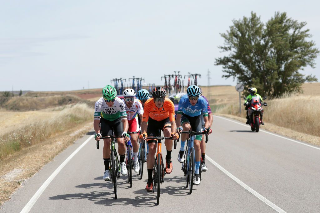 BURGOS SPAIN AUGUST 03 LR Sergio Roman Martin Galan of Spain and Team Caja RuralSeguros RGA Joan Bou Company of Spain and Team Euskaltel Euskadi Marton Dina of Hungary and EoloKometa Cycling Team lead The Breakaway during the 43rd Vuelta a Burgos 2021 Stage 1 a 161km stage from BurgosCatedral to BurgosAlto del Castillo 980m VueltaBurgos BurgosCycling CapitalMundialdelCiclismo catedral2021 on August 03 2021 in Burgos Spain Photo by Gonzalo Arroyo MorenoGetty Images