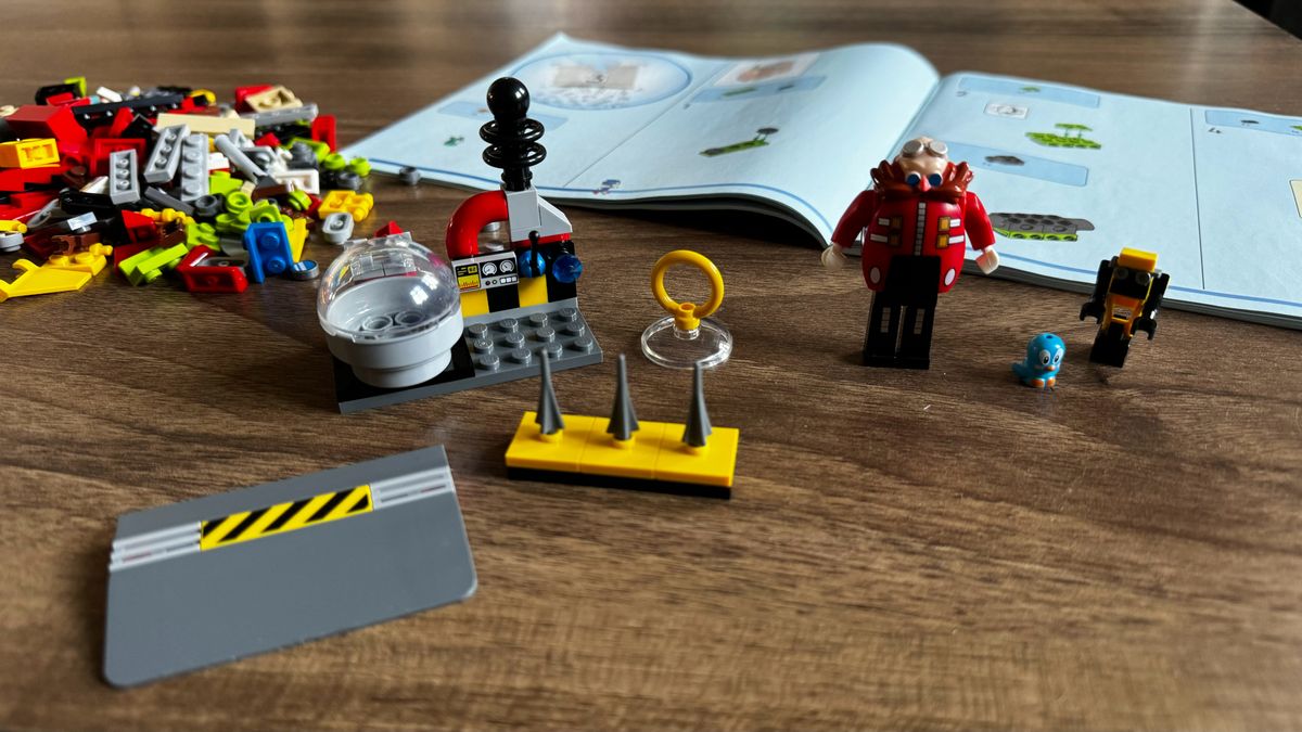 Lego Sonic vs. Dr. Eggman's Death Egg Robot set under construction on a wooden table