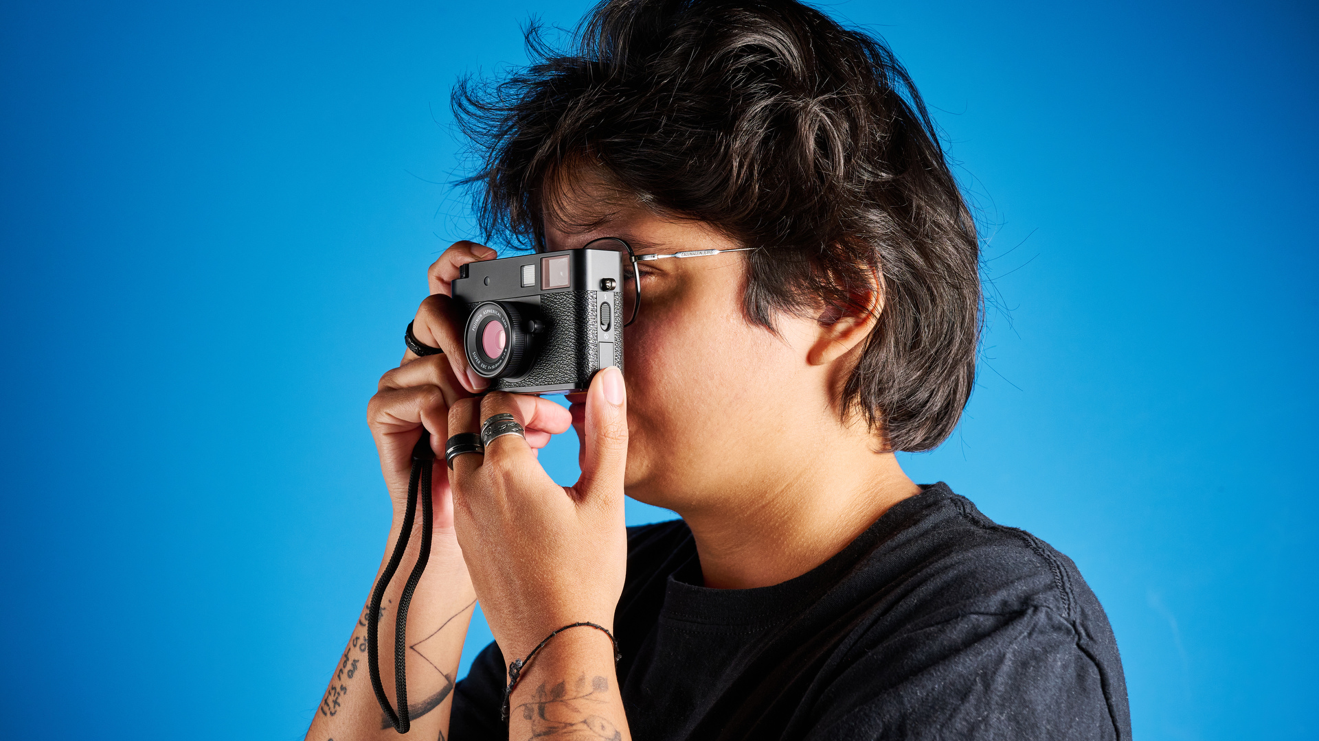 A black Fujifilm X half camera