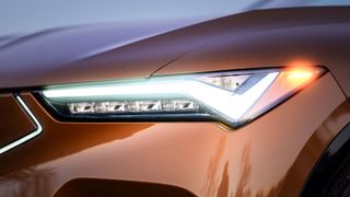 2024 Acura ZDX Type S headlight closeup.