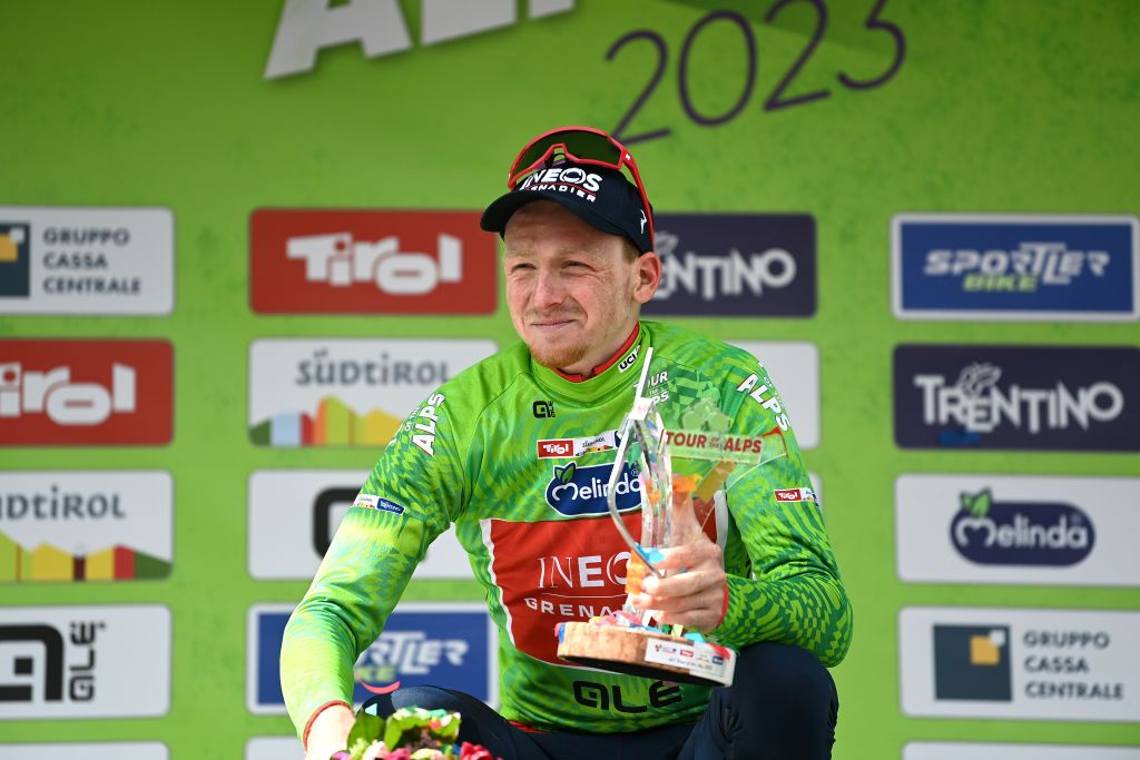 BRUNICO ITALY APRIL 21 Tao Geoghegan Hart of United Kingdom and Team INEOS Grenadiers Green Leader Jersey celebrates at podium as final overall winner during the 46th Tour of the Alps 2023 Stage 5 a 1445km stage from Cavalese to Brunico on April 21 2023 in Brunico Italy Photo by Tim de WaeleGetty Images