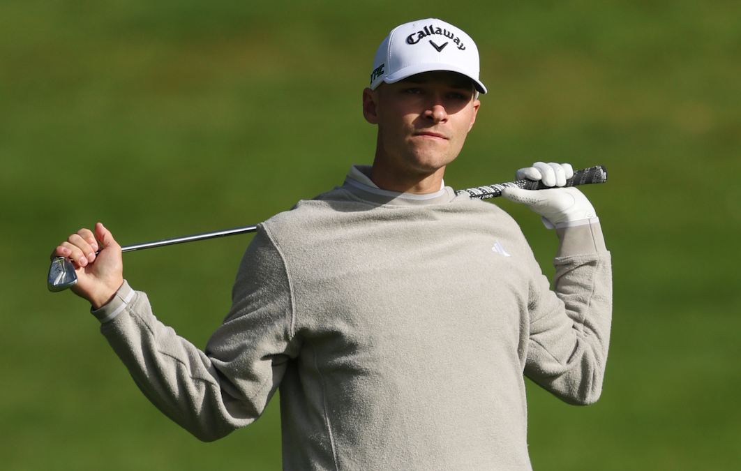 Nicolai Hojgaard holds an iron behind his back during the BMW PGA Championship