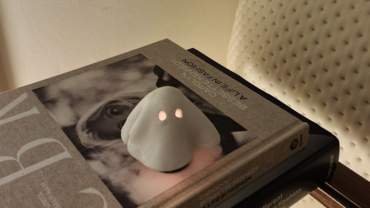 A ghost-shaped tea light cover made from air dry clay