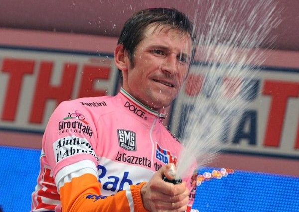 Denis Menchov (Rabobank) uncorks the bubbly on the podium.