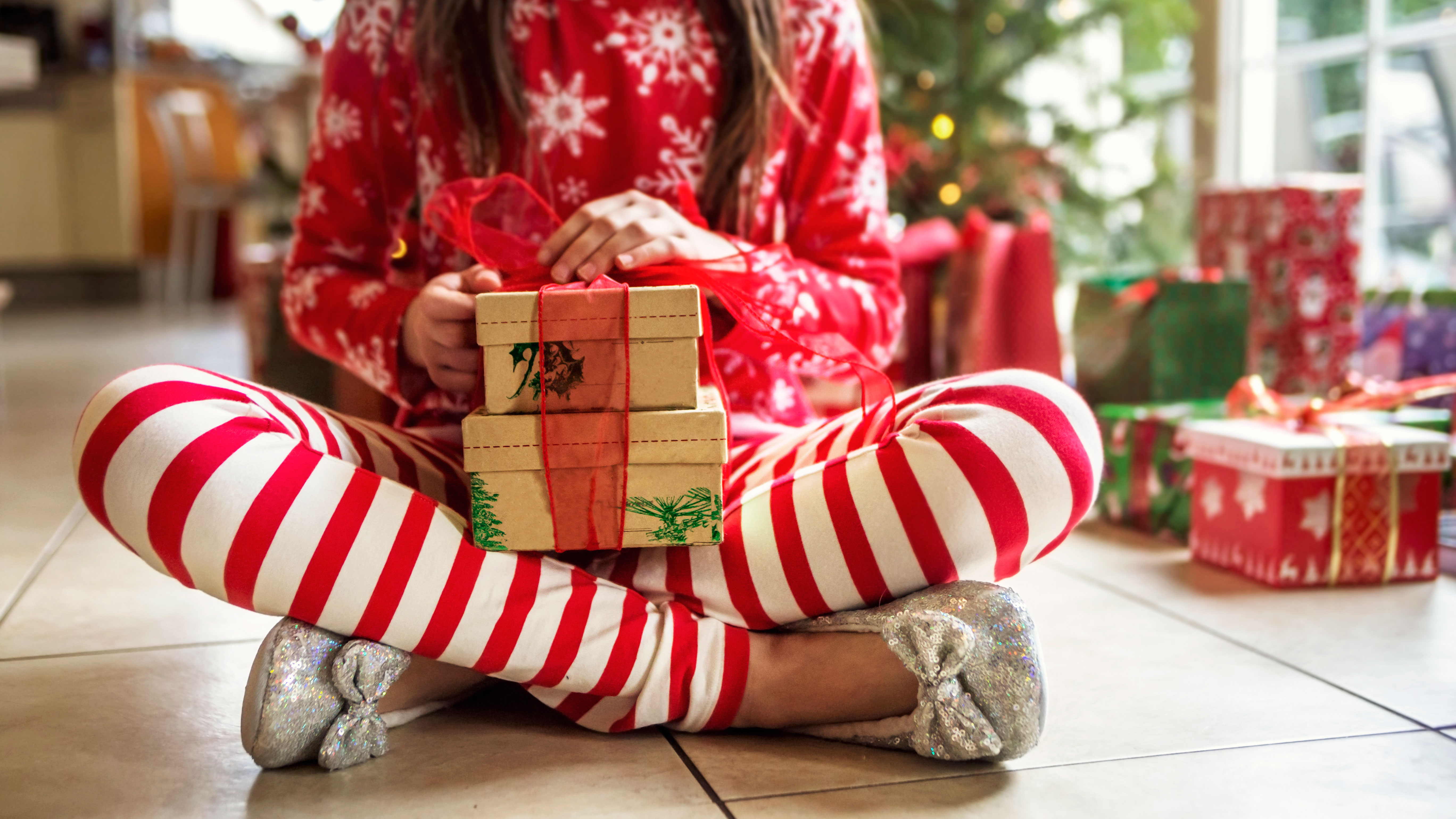 little girl with christmas present by getty images