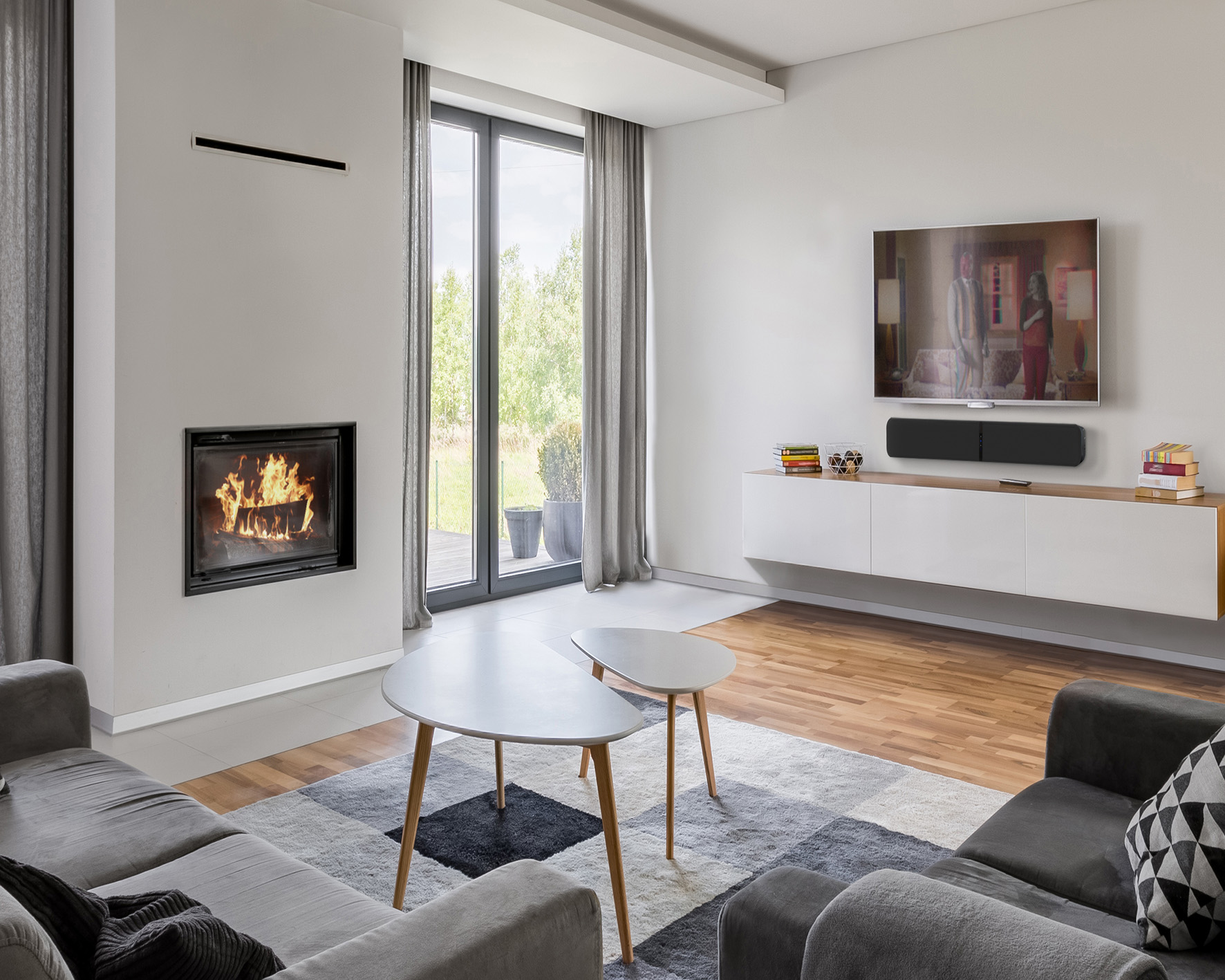 Fireplace and TV set up with a wall mounted soundbar