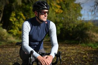 Male cyclist wearing Castelli Espresso Vest in Blue in the countryside