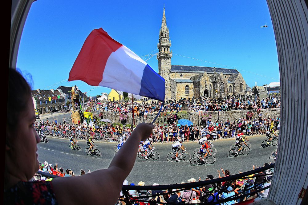 A spectator has a birds-eye view of stage 6 at the Tour de France