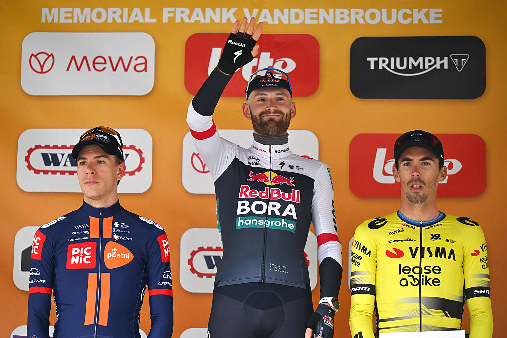 BINCHE, BELGIUM - OCTOBER 07: (L-R) Nils Eekhoff of Netherlands and Team Picnic PostNL on second place, race winner Jordi Meeus of Belgium and Team Red Bull - BORA - hansgrohe and Christophe Laporte of France and Team Visma | Lease a Bike on third place pose on the podium ceremony after the 38th Binche - Chimay - Binche / Memorial Frank Vandenbroucke 2025 a 203.2km one day race from Binche to Binche on October 07, 2025 in Binche, Belgium. (Photo by Luc Claessen/Getty Images)