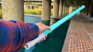 Nanlite PavoTube T8-7X light wand held in reviewer's hand