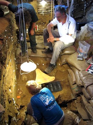 Archaeologists excavate Blombos Cave.