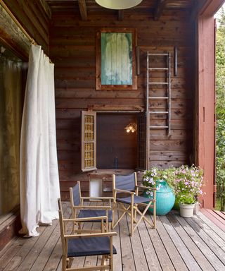 Entrance porch that doubles as a sun terrace in Isabella Rossellini's Long Island rustic barn
