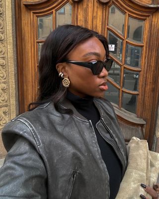 Nnenna Chem in black cat-eye sunglasses