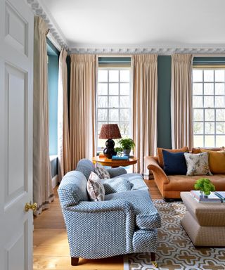 Blue and rust patterned living room in classic Georgian style Cotswolds newbuild country house