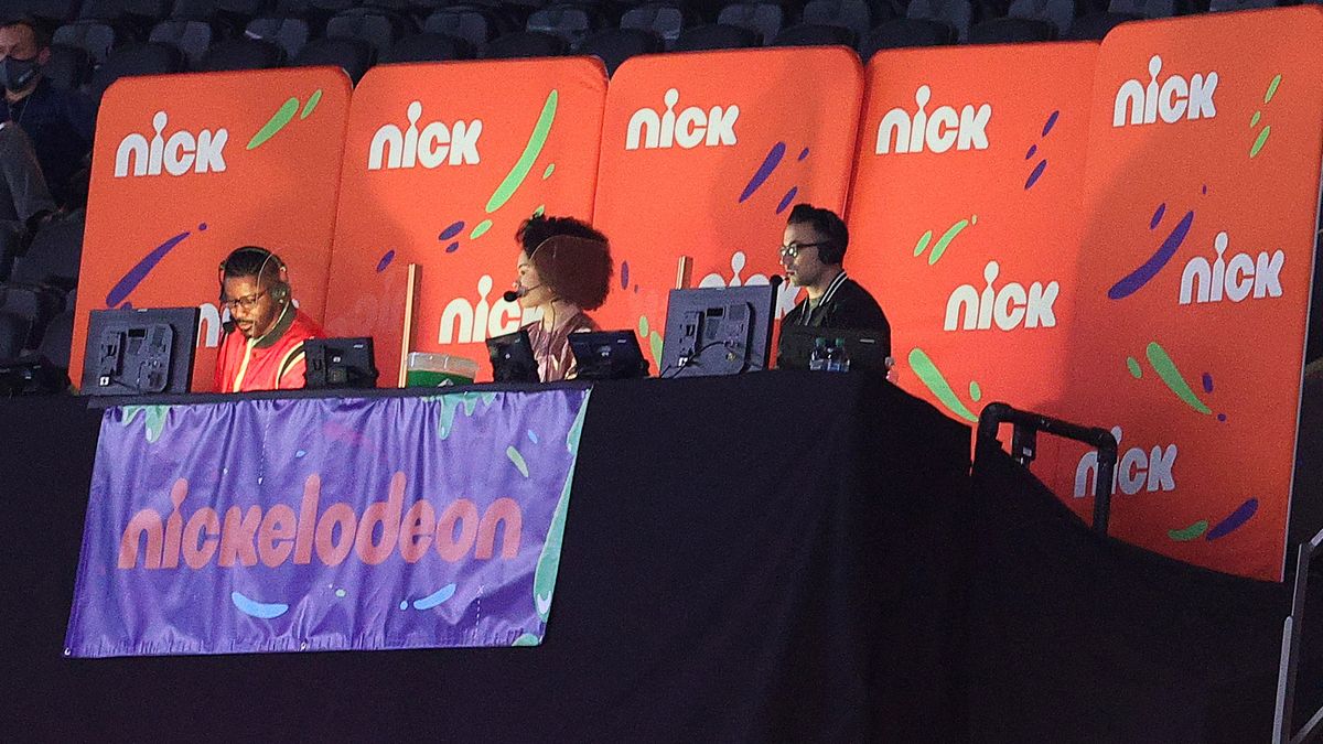 From left, Nate Burleson, Gabrielle Nevaeh Green and Noah Eagle work the Nickelodeon booth for the Saints-Bears playoff game.