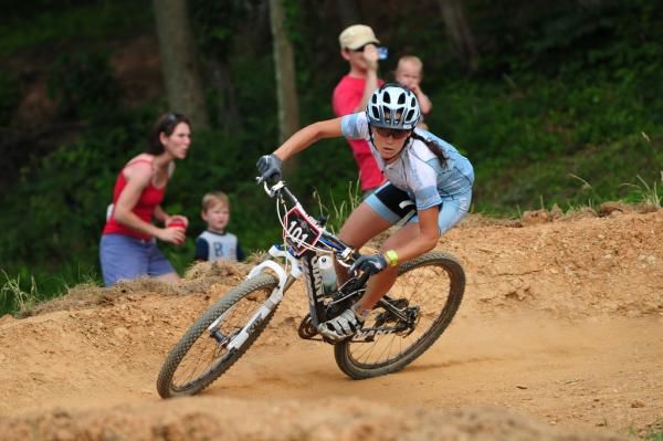 Kelli Emmett (Giant) takes a berm while racing solo off the front toward victory.