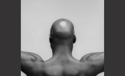 Back on a topless dark skinned man