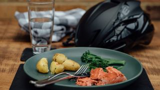 Plate of food and a cycling helmet