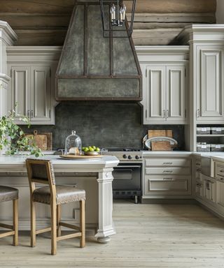 grand kitchen with large canopy cooker hood