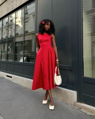 French woman wearing a red Helsa dress