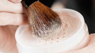 Woman using a mattifying powder