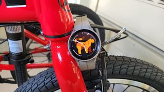 Samsung Galaxy Watch 5 Pro sitting on a bike. It has a custom watch face with complications.