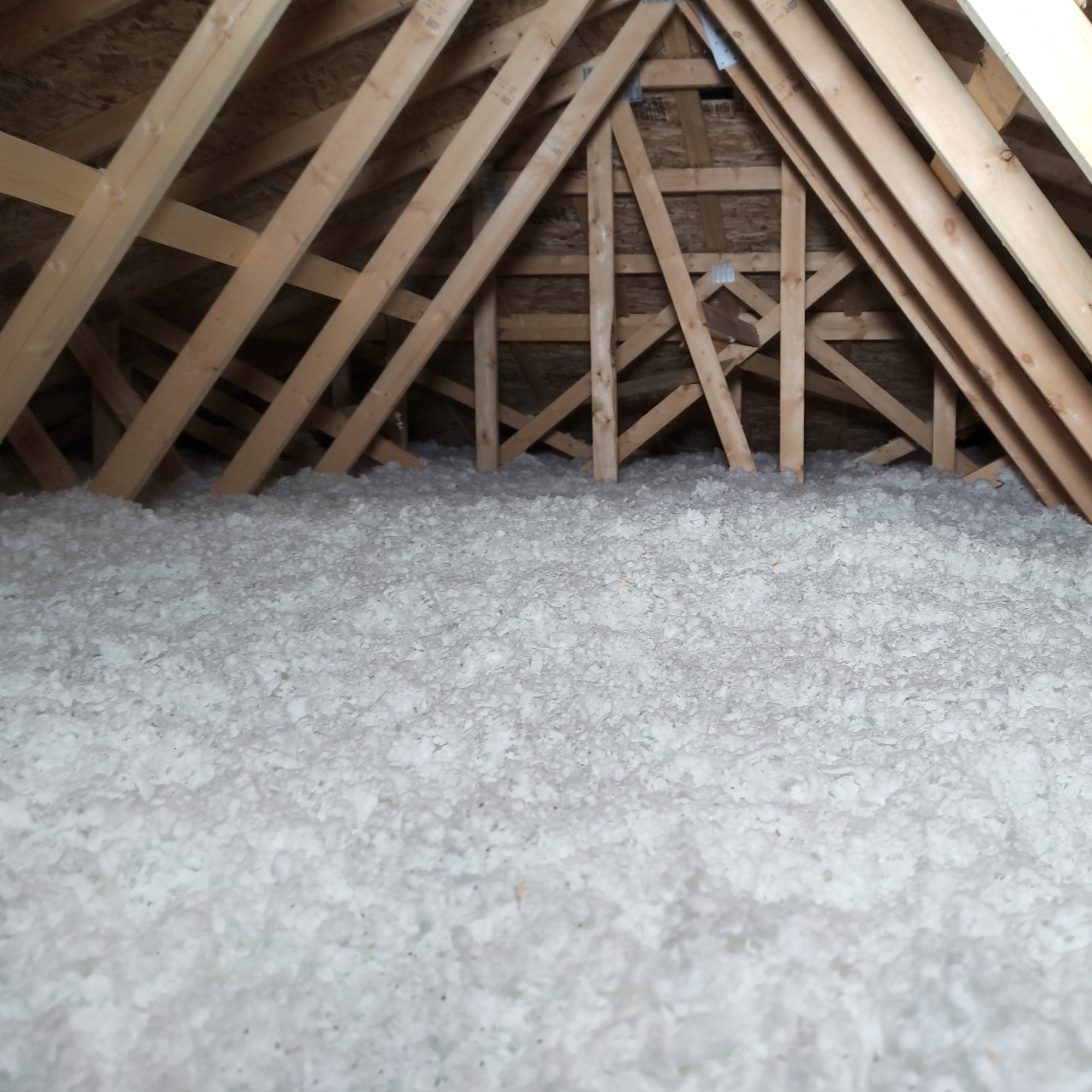 Loose fill cellulose insulation that has been blown in an attic space