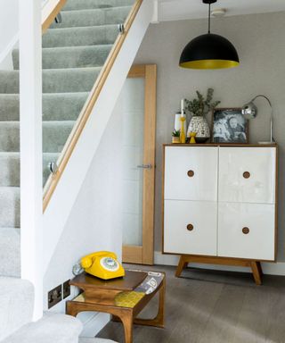 staircase with white cupboard