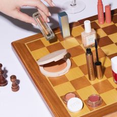 Make up products sold at Naturisimo on a wooden chessboard