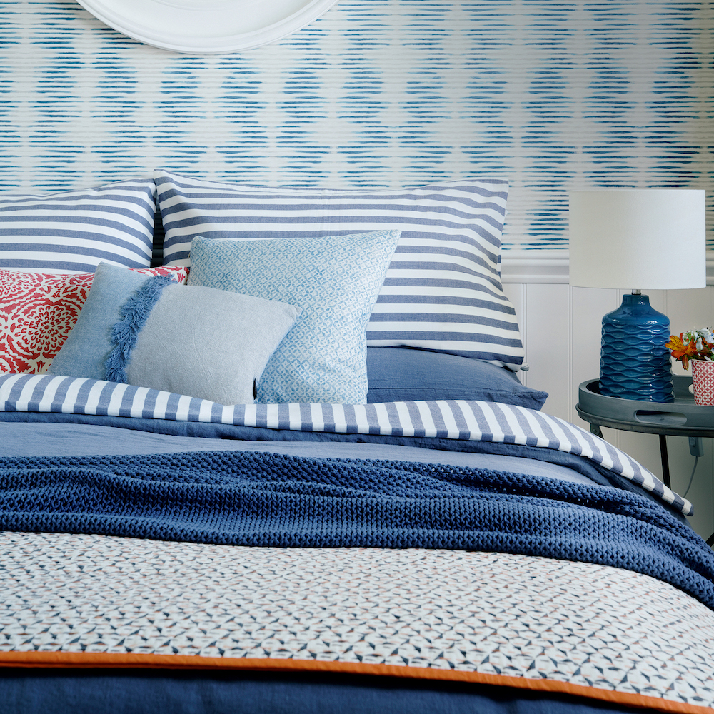 bedroom with blue and white printed wall