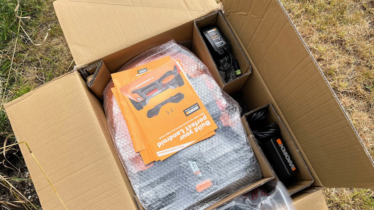 Worx WR165 20-Volt 7 in. 2.0 Ah Robotic Landroid Mower being tested in writer's yard