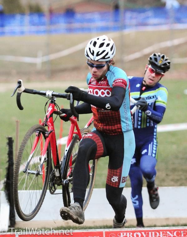 A B2C2 racer running the barriers