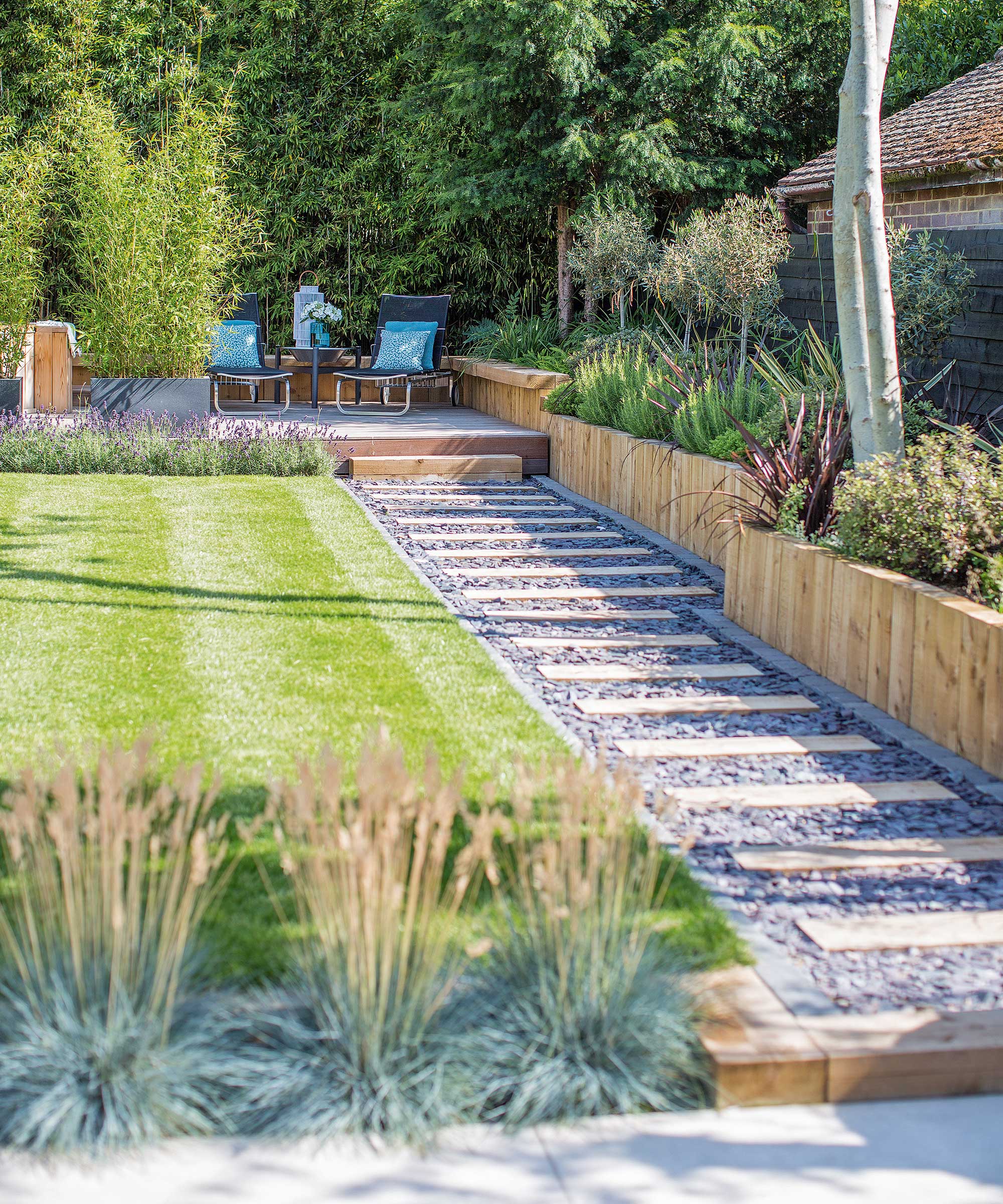 path, raised beds and lawn in modern garden