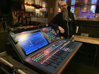 A Midas HD96 in the House of Blue Las Vegas, lit up in multicolor lights and illuminated monitor.