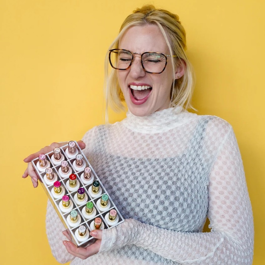 Katie Masters holding her nail polishes.