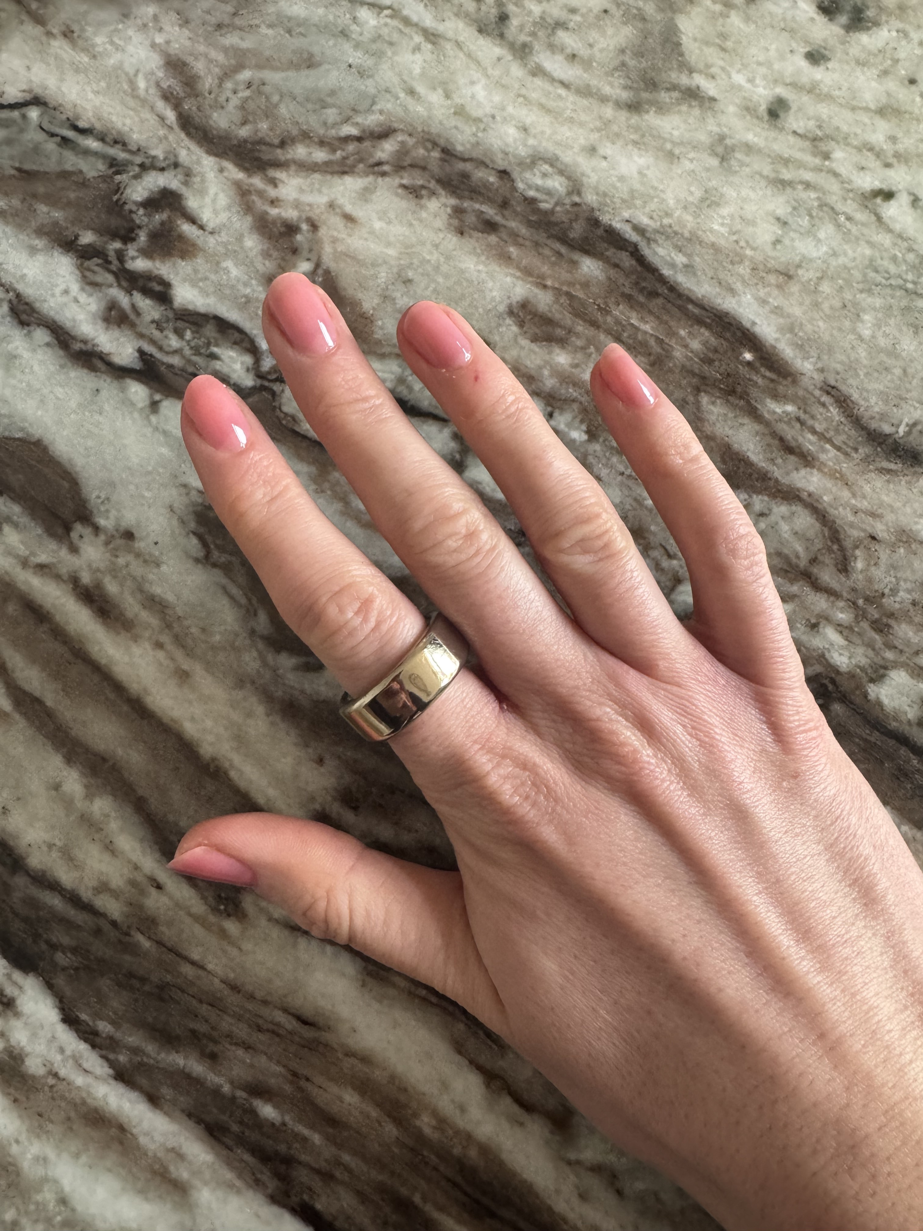 Eleanor's nails painted with three coats of Essie Glass Nails polish in shade Cin Cin