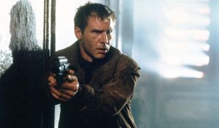 Harrison Ford walks down a hallway armed in Blade Runner: The Final Cut