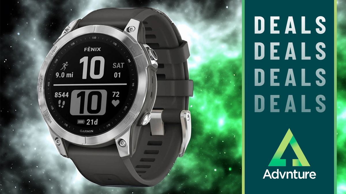 Garmin Fenix 7 watch on green nebula background