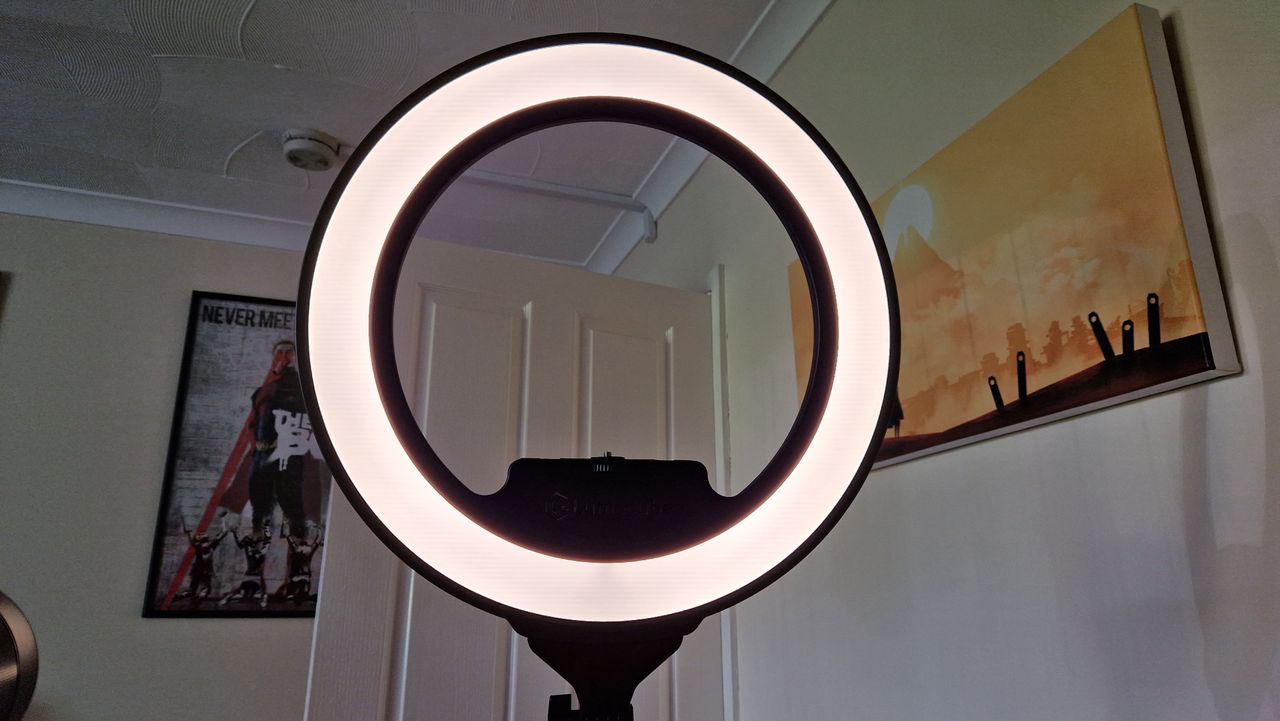 Lumecube Ring Light Pro while on in front of a white door and wall